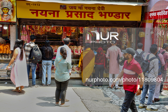 A shop sells religious items by the Naini Devi Temple at the Bhutia Bazaar (Tibetan Market) in Nainital, Uttarakhand, India, on April 19, 20...