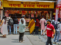 A shop sells religious items by the Naini Devi Temple at the Bhutia Bazaar (Tibetan Market) in Nainital, Uttarakhand, India, on April 19, 20...