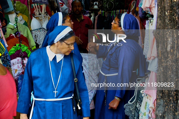 Nuns shop at the Bhutia Bazaar (Tibetan Market) in Nainital, Uttarakhand, India, on April 19, 2024. The Tibetan Market is located by Naini L...