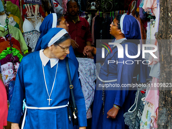 Nuns shop at the Bhutia Bazaar (Tibetan Market) in Nainital, Uttarakhand, India, on April 19, 2024. The Tibetan Market is located by Naini L...