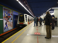 People wait for the metro during Black Friday week in Warsaw, Poland, on November 25, 2024. (