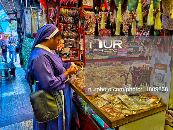 A nun shops at the Bhutia Bazaar (Tibetan Market) in Nainital, Uttarakhand, India, on April 19, 2024. The Tibetan Market is located by Naini...