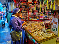 A nun shops at the Bhutia Bazaar (Tibetan Market) in Nainital, Uttarakhand, India, on April 19, 2024. The Tibetan Market is located by Naini...