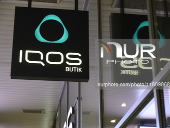 An Iqos store signage is pictured during Black Friday week in Warsaw, Poland, on November 25, 2024. (