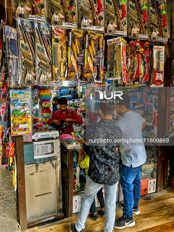 Youth buy toy guns at a shop in the Bhutia Bazaar (Tibetan Market) in Nainital, Uttarakhand, India, on April 19, 2024. The Tibetan Market is...