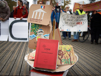 An Environment Code (French law) is pictured during the gathering. People gather in Toulouse, France, on November 25, 2024, as plaintiffs (L...