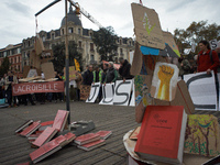 An Environment code is pictured during the gathering. People gather in Toulouse, France, on November 25, 2024, as plaintiffs (LVEL, Attac, A...