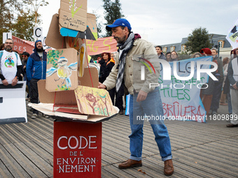 People gather in Toulouse, France, on November 25, 2024, as plaintiffs (LVEL, Attac, Amis de la Terre, D'Ingrando, etc.) against the planned...