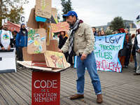 People gather in Toulouse, France, on November 25, 2024, as plaintiffs (LVEL, Attac, Amis de la Terre, D'Ingrando, etc.) against the planned...