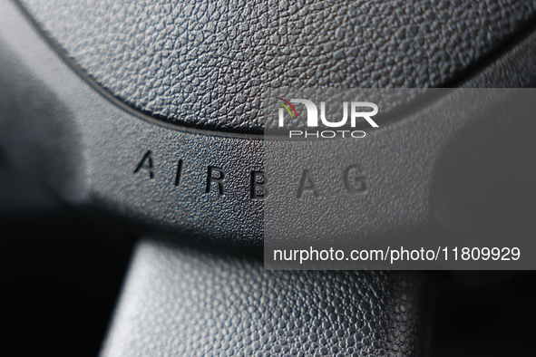 Airbag logo is seen on a steering wheel in Poland on November 24, 2024. 