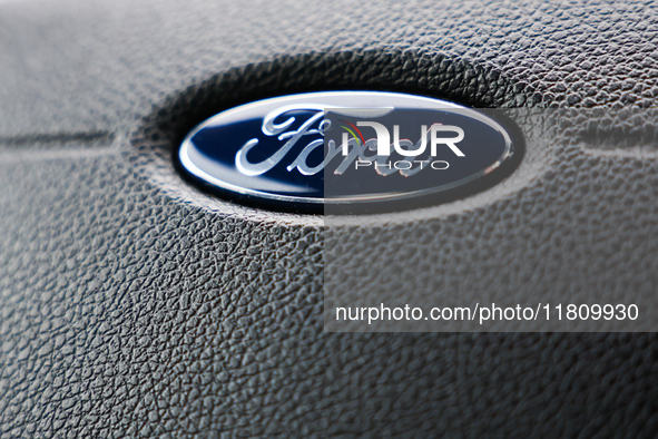 Ford logo is seen on a steering wheel in Poland on November 24, 2024. 