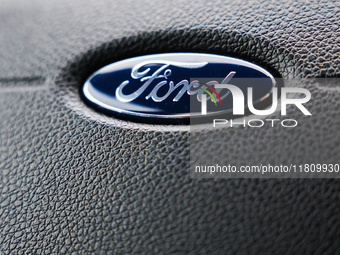 Ford logo is seen on a steering wheel in Poland on November 24, 2024. (