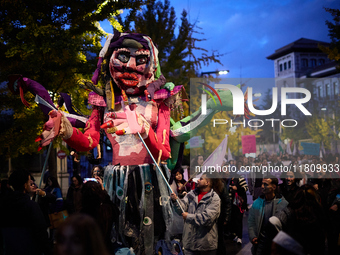 A giant doll made by students of a school represents women's freedom during the 25N demonstration, International Day for the Elimination of...