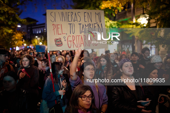 A protester holds a banner reading 'If you were living in my skin, you would scream too' during the 25N demonstration, International Day for...