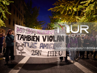 Protesters hold a banner reading 'They are not strangers, your friends also rape' and shout slogans during the 25N demonstration, Internatio...