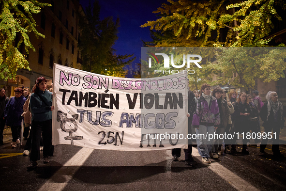 Protesters hold a banner reading 'They are not strangers, your friends also rape' and shout slogans during the 25N demonstration, Internatio...