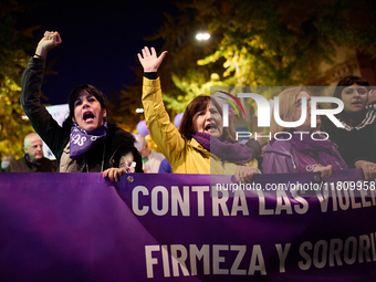 Protesters hold banners and shout slogans during the 25N demonstration, International Day for the Elimination of Violence against Women, in...