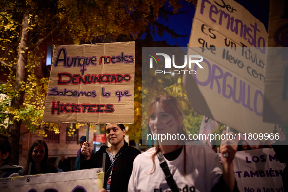 A protester holds a banner reading 'Even if you are not reported, we know what you did' during the 25N demonstration, International Day for...