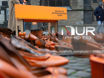 Orange shoes are displayed under a Christmas tree as a symbol against violence against women in Cologne, Germany, on November 25, 2024, duri...