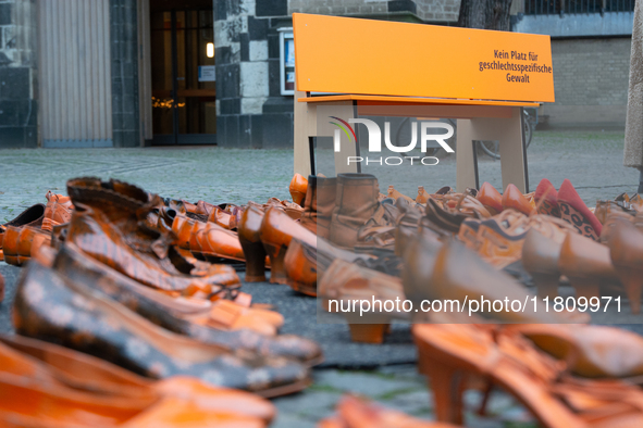 Orange shoes are displayed under a Christmas tree as a symbol against violence against women in Cologne, Germany, on November 25, 2024, duri...