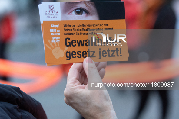 A hundred participants take part in a demonstration for International Women's Day in Bonn, Germany, on November 25, 2024, to raise awareness...