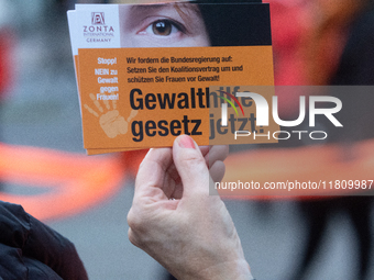 A hundred participants take part in a demonstration for International Women's Day in Bonn, Germany, on November 25, 2024, to raise awareness...