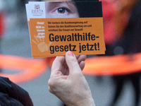 A hundred participants take part in a demonstration for International Women's Day in Bonn, Germany, on November 25, 2024, to raise awareness...