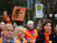 A hundred participants take part in a demonstration for International Women's Day in Bonn, Germany, on November 25, 2024, to raise awareness...