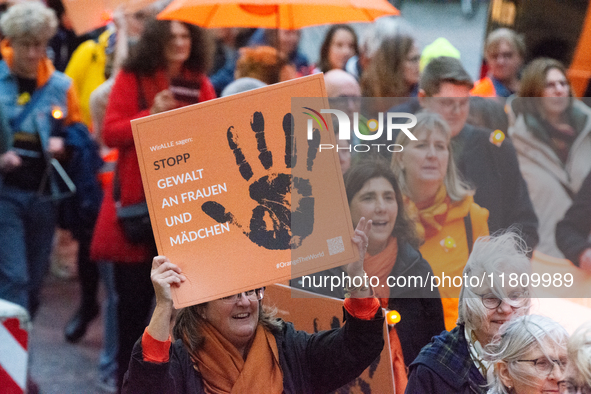 A hundred participants take part in a demonstration for International Women's Day in Bonn, Germany, on November 25, 2024, to raise awareness...