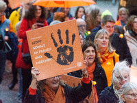 A hundred participants take part in a demonstration for International Women's Day in Bonn, Germany, on November 25, 2024, to raise awareness...