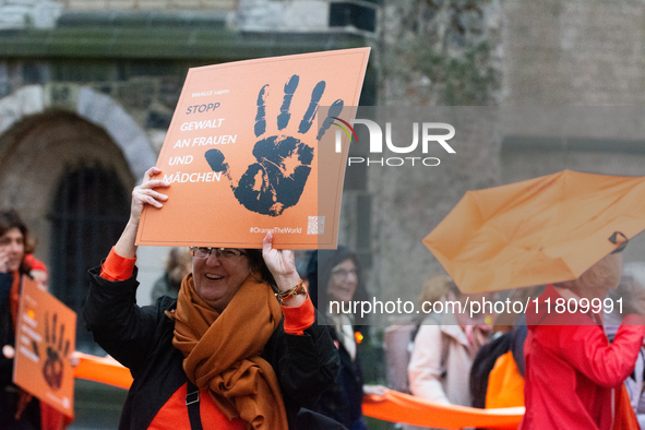 A hundred participants take part in a demonstration for International Women's Day in Bonn, Germany, on November 25, 2024, to raise awareness...