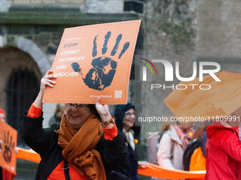 A hundred participants take part in a demonstration for International Women's Day in Bonn, Germany, on November 25, 2024, to raise awareness...