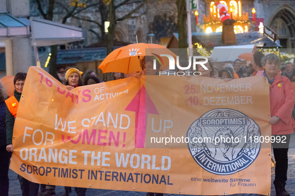 A hundred participants take part in a demonstration for International Women's Day in Bonn, Germany, on November 25, 2024, to raise awareness...