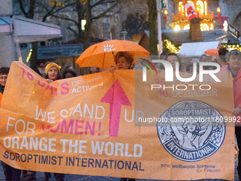 A hundred participants take part in a demonstration for International Women's Day in Bonn, Germany, on November 25, 2024, to raise awareness...