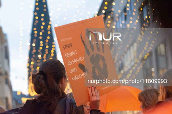 A hundred participants take part in a demonstration for International Women's Day in Bonn, Germany, on November 25, 2024, to raise awareness...