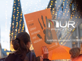 A hundred participants take part in a demonstration for International Women's Day in Bonn, Germany, on November 25, 2024, to raise awareness...