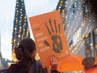 A hundred participants take part in a demonstration for International Women's Day in Bonn, Germany, on November 25, 2024, to raise awareness...