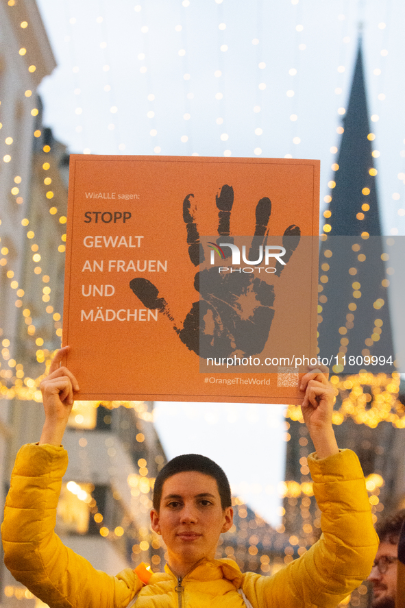 A hundred participants take part in a demonstration for International Women's Day in Bonn, Germany, on November 25, 2024, to raise awareness...