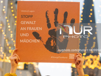 A hundred participants take part in a demonstration for International Women's Day in Bonn, Germany, on November 25, 2024, to raise awareness...