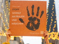 A hundred participants take part in a demonstration for International Women's Day in Bonn, Germany, on November 25, 2024, to raise awareness...