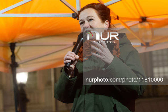 Katja Dorner, the mayor of Bonn, speaks during the candlelight vigil in front of Bonn Town Hall as hundreds of participants take part in a d...