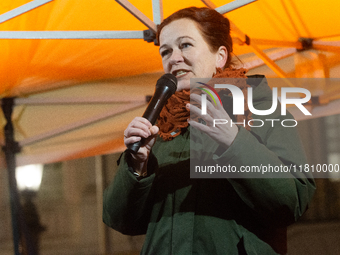 Katja Dorner, the mayor of Bonn, speaks during the candlelight vigil in front of Bonn Town Hall as hundreds of participants take part in a d...