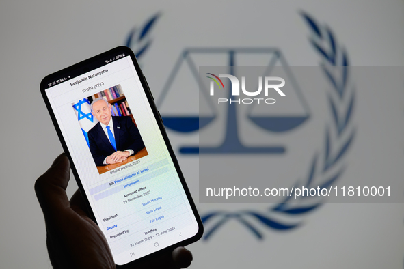 Benjamin Netanyahu appears on a smartphone with the International Criminal Court logo visible in the background in this photo illustration i...