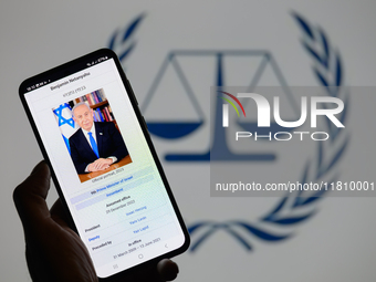 Benjamin Netanyahu appears on a smartphone with the International Criminal Court logo visible in the background in this photo illustration i...