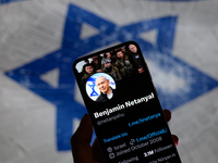 Benjamin Netanyahu's social media is displayed on a smartphone with the flag of Israel visible in the background in this photo illustration...