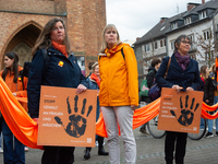 A hundred participants take part in a demonstration for International Women's Day in Bonn, Germany, on November 25, 2024, to raise awareness...