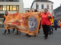 A hundred participants take part in a demonstration for International Women's Day in Bonn, Germany, on November 25, 2024, to raise awareness...