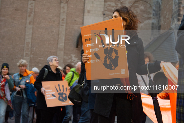 A hundred participants take part in a demonstration for International Women's Day in Bonn, Germany, on November 25, 2024, to raise awareness...