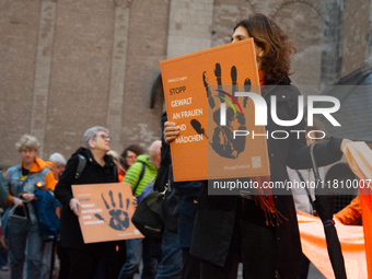 A hundred participants take part in a demonstration for International Women's Day in Bonn, Germany, on November 25, 2024, to raise awareness...