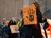 A hundred participants take part in a demonstration for International Women's Day in Bonn, Germany, on November 25, 2024, to raise awareness...